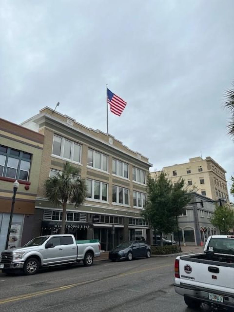 Winter Haven Fire Department Rehangs American Flag After It Blew Down